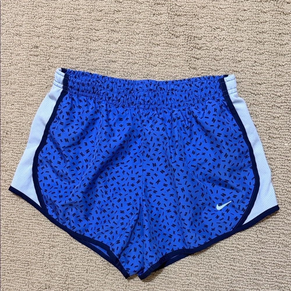 Nike Girls Blue Athletic Running Shorts with Gray Trim, Size Medium.